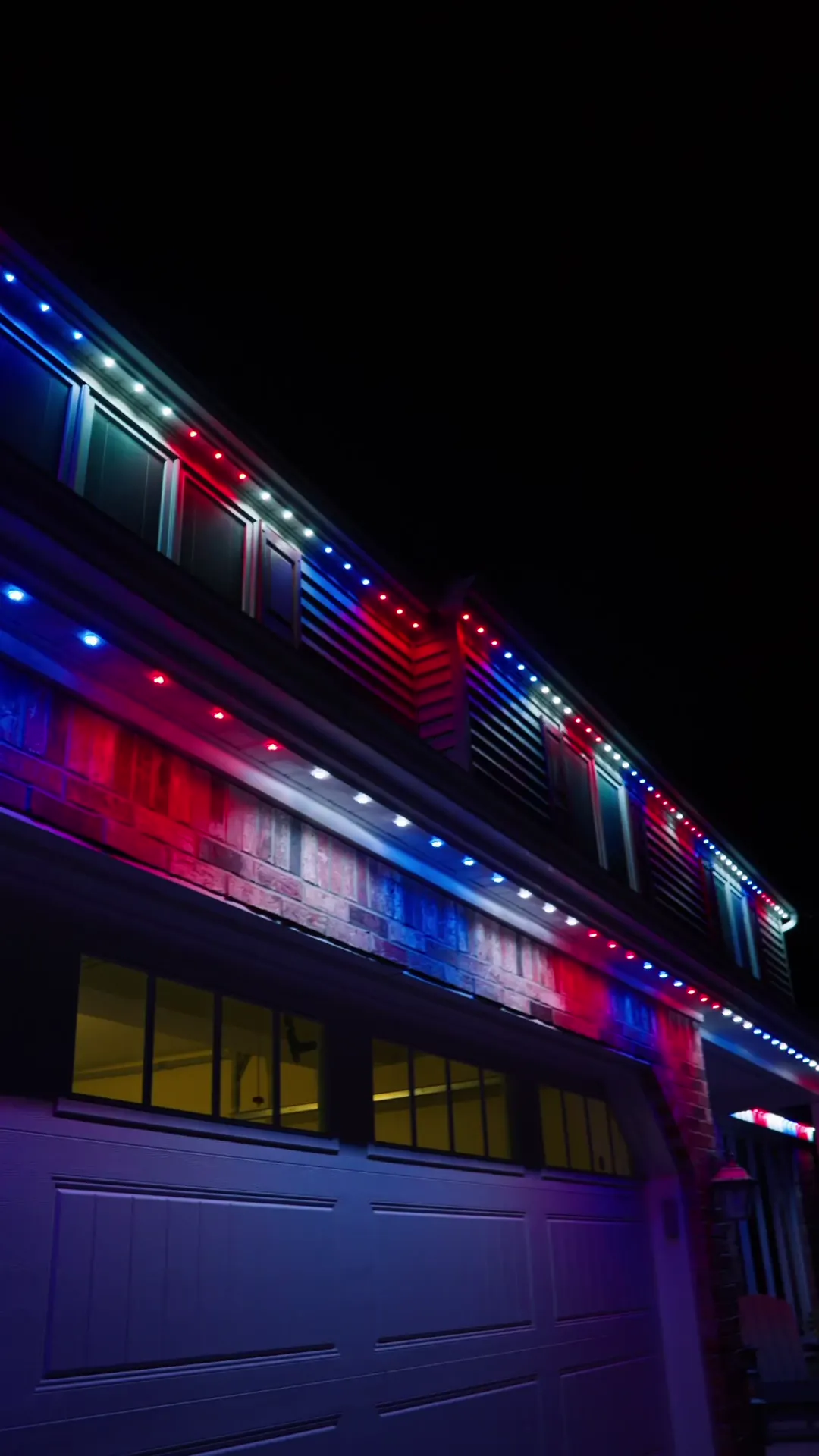 The same Lancaster home lit red, white and blue