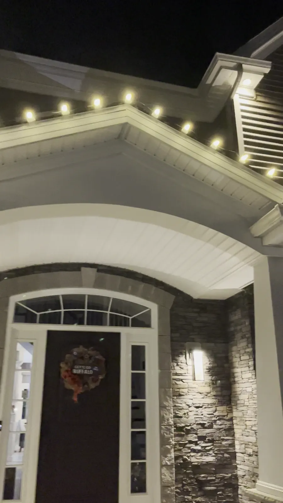 Clarence porch gable with white bulbs