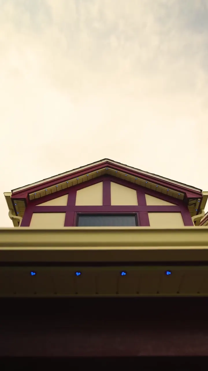 The Tudor's front dormer in daylight, channel blending into the trim